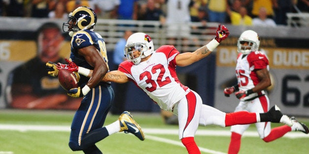 ST. LOUIS, MO - SEPTEMBER 8: Safety Tyrann Mathieu #32 of the Arizona Cardinals strips the ball from tight end Jared Cook #89