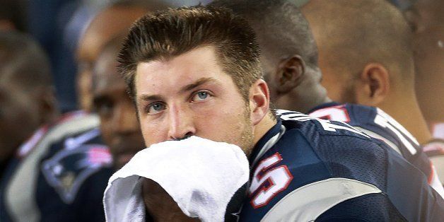 FOXBOROUGH, MA - AUGUST 29: Patriots quarterback Tim Tebow on the bench after another three and out in the third quarter. The New England Patriots hosted the New York Giants in an NFL pre-season game at Gillette Stadium. (Photo by Jim Davis/The Boston Globe via Getty Images)