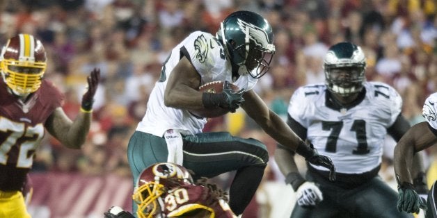 Philadelphia Eagles running back LeSean McCoy (25) avoids a tackle by Washington Redskins cornerback E.J. Biggers (30), during a touchdown run in the third quarter at FedEx Field in Landover, Maryland, Monday, September 9, 2013. (Harry E. Walker/MCT via Getty Images)