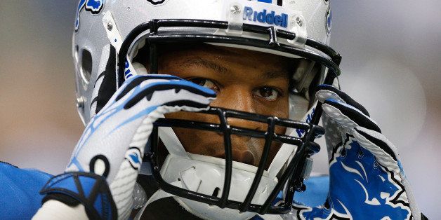 DETROIT, MI - SEPTEMBER 08: Ndamukong Suh #90 of the Detroit Lions adjusts his helmet during pre game prior to playing the Minnesota Vikings at Ford Field on September 8, 2013 in Detroit, Michigan. (Photo by Gregory Shamus/Getty Images)