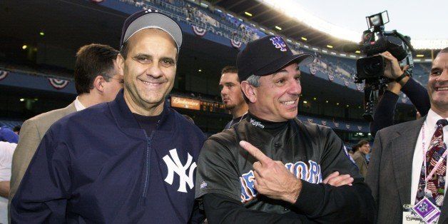 UNITED STATES - CIRCA 2000: New York Yankees' manager Joe Torre jokes with New York Mets' manager Bobby Valentine before Game 1 of the World Series between the Yankees and Mets at Yankee Stadium. The Yanks won the first game of the Subway Series, 4-3. (Photo by Howard Earl Simmons/NY Daily News Archive via Getty Images)