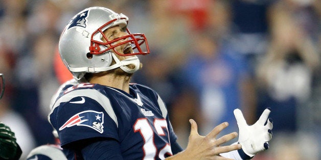 FOXBORO, MA - SEPTEMBER 12: Quarterback Tom Brady #12 of the New England Patriots reacts after an incomplete pass in the second quarter while taking on the New York Jets at Gillette Stadium on September 12, 2013 in Foxboro, Massachusetts. (Photo by Jim Rogash/Getty Images)