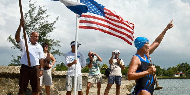US swimmer Diana Nyad (R) gestures before her departure from the Ernest Hemingway Nautical Club in Havana on August 18, 2012 . Veteran US endurance swimmer Diana Nyad announced that she will try to swim the treacherous waters from Cuba to Florida without a shark cage. AFP PHOTO/ADALBERTO ROQUE (Photo credit should read ADALBERTO ROQUE/AFP/GettyImages)