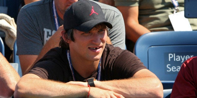 NEW YORK, NY - AUGUST 30: Hockey player Alexander Ovechkin of the Washington Capitol looks on as Maria Kirilenko of Russia plays against Greta Arn of Hungary during Day Four of the 2012 US Open at USTA Billie Jean King National Tennis Center on August 30, 2012 in the Flushing neigborhood of the Queens borough of New York City. (Photo by Cameron Spencer/Getty Images)