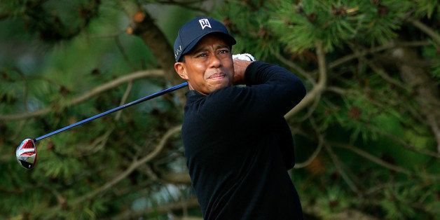 LAKE FOREST, IL - SEPTEMBER 16: Tiger Woods hits off the fourth tee during the Final Round of the BMW Championship at Conway Farms Golf Club on September 16, 2013 in Lake Forest, Illinois. (Photo by Michael Cohen/Getty Images)