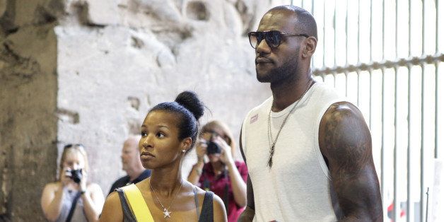 ROME, ITALY - SEPTEMBER 18: LeBron James (R) and his new wife Savannah Brinson (L) are spotted on their honeymoon at The Colosseum on September 18, 2013 in Rome, Italy. (Photo by Tiffany Rose/FilmMagic)