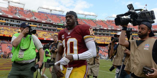 LANDOVER, MD - SEPTEMBER 22: Washington Redskins quarterback Robert Griffin III (10) leaves the field following their 27-20 loss to the Detroit Lions at FedEx Field on September 22, 2013 in Landover, MD. (Photo by Jonathan Newton / The Washington Post via Getty Images)