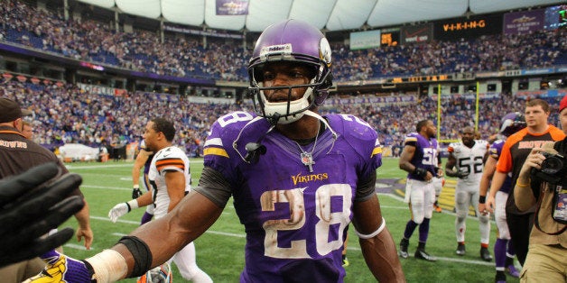 MINNEAPOLIS, MN - SEPTEMBER 22: Adrian Peterson #28 of the Minnesota Vikings shakes hands after loosing against the Cleveland Browns on September 22, 2013 at Mall of America Field at the Hubert Humphrey Metrodome in Minneapolis, Minnesota. (Photo by Adam Bettcher/Getty Images)