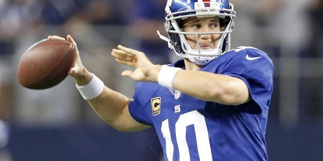 Giants quarterback Eli Manning warms up as New York Giants faced the Dallas Cowboys at AT&T Stadium in Arlington, Texas, on Sunday, September 8, 2013. (Ron Jenkins/Fort Worth Star-Telegram/MCT via Getty Images)