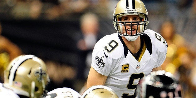 NEW ORLEANS, LA - SEPTEMBER 08: Drew Brees #9 of the New Orleans Saints calls a play at the line of scrimmage against the Atlanta Falcons during a game at the Mercedes-Benz Superdome on September 8, 2013 in New Orleans, Louisiana. The Saints defeated the Atlanta Falcons 23-17. (Photo by Stacy Revere/Getty Images)