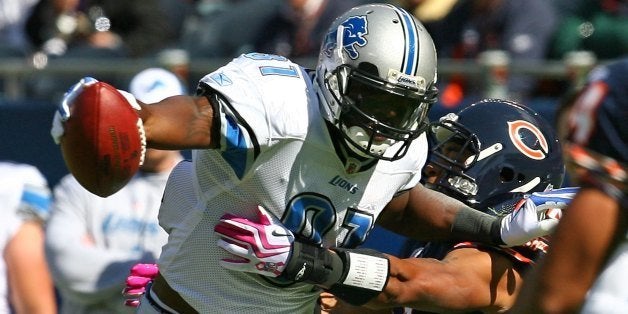 CHICAGO - OCTOBER 04: Calvin Johnson #81 of the Detroit Lions breaks away from Kevin Payne #44 of the Chicago Bears on October 4, 2009 at Soldier Field in Chicago, Illinois. The Bears defeated the Lions 48-24. (Photo by Jonathan Daniel/Getty Images)