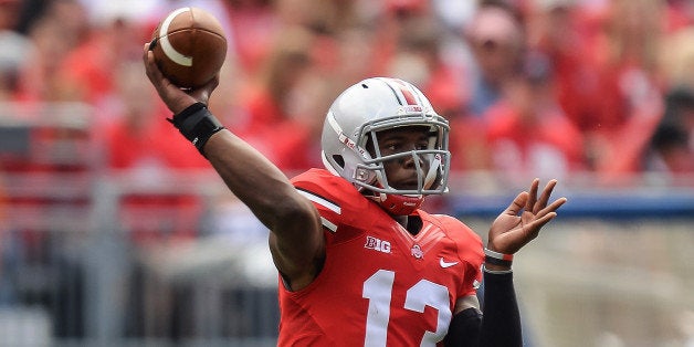 COLUMBUS, OH - SEPTEMBER 21: Kenny Guiton #13 of the Ohio State Buckeyes passes against the Florida A&M Rattlers at Ohio Stadium on September 21, 2013 in Columbus, Ohio. (Photo by Jamie Sabau/Getty Images)