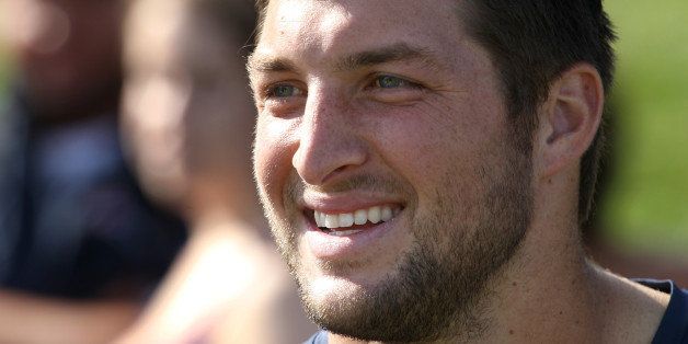 FOXBOROUGH, MA - AUGUST 15: Tim Tebow as the New England Patriots end their last practice, on Thursday, August 15, 2013, before the Friday exhibition game against the Tampa Bay Buccaneers. (Pat Greenhouse/The Boston Globe via Getty Images)