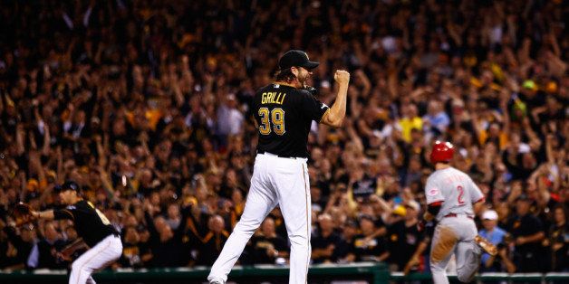 PITTSBURGH, PA - OCTOBER 01: Jason Grilli #39 of the Pittsburgh Pirates celebrates during the final play outfield their 6 to 2 win over the Cincinnati Reds during the National League Wild Card game at PNC Park on October 1, 2013 in Pittsburgh, Pennsylvania. (Photo by Jared Wickerham/Getty Images)