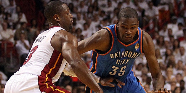 Miami Heat's Dwyane Wade guards Oklahoma City Thunder's Kevin Durant in the second quarter during Game 3 of the NBA Finals at the AmericanAirlines Arena in Miami, Florida on Sunday, June 17, 2012. (Pedro Portal/El Nuevo Herald/MCT via Getty Images)