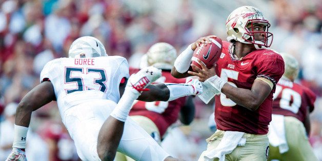 TALLAHASSEE, FL - OCTOBER 5: Jameis Winston #5 of the Florida State Seminoles dodges a sack attempt made by L.A. Goree #53 of the Maryland Terrapins during the first half on October 5, 2013 at Doak Campbell Stadium in Tallahassee, Florida (Photo by Jeff Gammons/Getty Images)