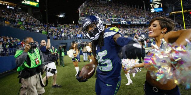 SEATTLE, WA - SEPTEMBER 15: Cornerback Richard Sherman #25 of the Seattle Seahawks celebrates after making an interception in the second half against the San Francisco 49ers at CenturyLink Field on September 15, 2013 in Seattle, Washington. (Photo by Otto Greule Jr/Getty Images)