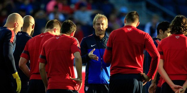 KANSAS CITY, KS - OCTOBER 09: Head coach Jürgen Klinsmann talks with players during a training session for the US Men's National Soccer Team in advance of their game vs Jamaica at Sporting Park on October 9, 2013 in Kansas City, Kansas. (Photo by Jamie Squire/Getty Images)