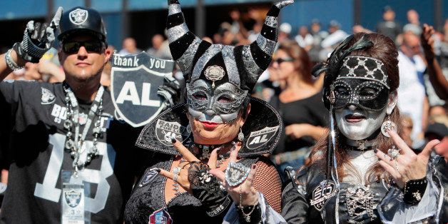 OAKLAND, CA - SEPTEMBER 15: Oakland Raiders fans cheer on their team against the Jacksonville Jaguars on September 15, 2013 at O.co Coliseum in Oakland, California. The Raiders won 19-9. (Photo by Brian Bahr/Getty Images)