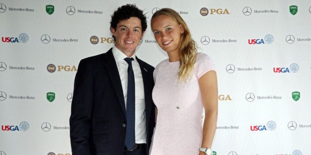 AUGUSTA, GA - APRIL 10: Rory McIlroy of Northern Ireland and Caroline Wozniacki of Denmark attend the US Golf Writers Dinner
