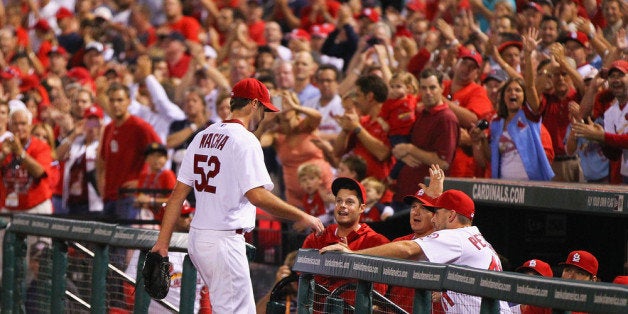 ST. LOUIS, MO - SEPTEMBER 24: Starting pitcher Michael Wacha #52 of the St. Louis Cardinals is congratulated by fans and te