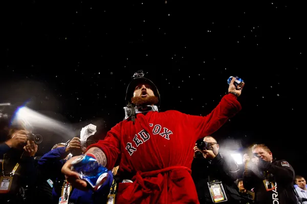 Shirtless Mike Napoli celebrates with helmeted Jonny Gomes 