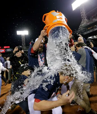 Shirtless Mike Napoli celebrates with helmeted Jonny Gomes 