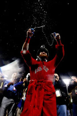 Shirtless Mike Napoli celebrates with helmeted Jonny Gomes 