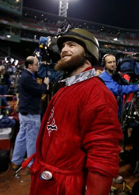 Shirtless Mike Napoli celebrates with helmeted Jonny Gomes 