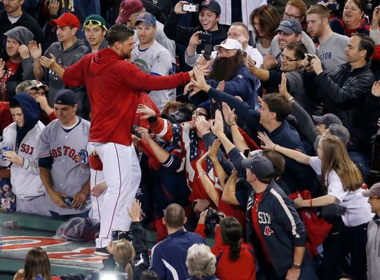 Shirtless Mike Napoli celebrates with helmeted Jonny Gomes 