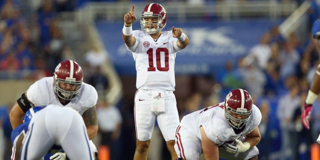 LEXINGTON, KY - OCTOBER 12: A J McCarron #10 of the Alabama Crimson Tide gives instructions to his team during the game agai
