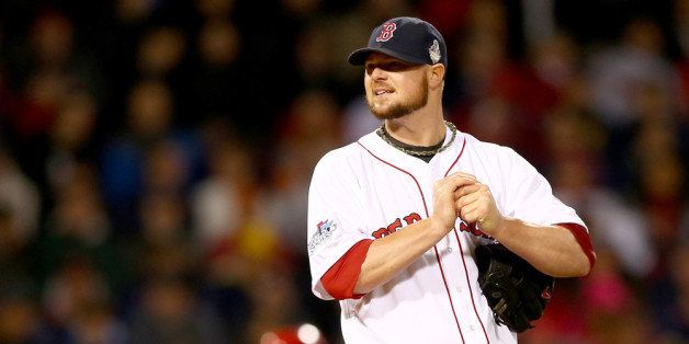 BOSTON, MA - OCTOBER 23: Jon Lester #31 of the Boston Red Sox looks on against the St. Louis Cardinals during Game One of the 2013 World Series at Fenway Park on October 23, 2013 in Boston, Massachusetts. (Photo by Elsa/Getty Images)