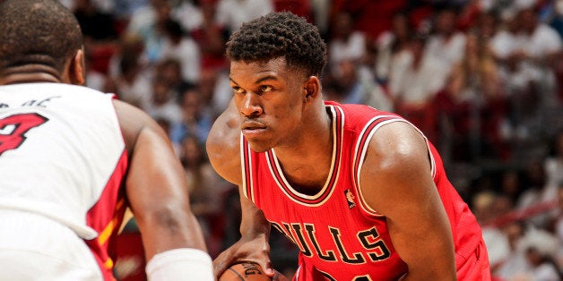 MIAMI, FL - MAY 6: Jimmy Butler #21 of the Chicago Bulls controls the ball against the Miami Heat in Game One of the Eastern Conference Semifinals during the 2013 NBA Playoffs on May 6, 2013 at American Airlines Arena in Miami, Florida. NOTE TO USER: User expressly acknowledges and agrees that, by downloading and/or using this photograph, user is consenting to the terms and conditions of the Getty Images License Agreement. Mandatory copyright notice: Copyright NBAE 2013 (Photo by Issac Baldizon/NBAE via Getty Images)