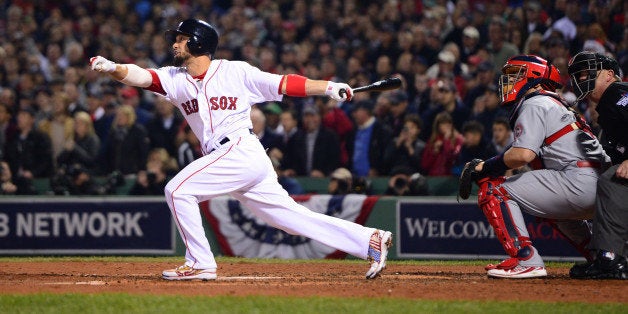 The Boston Red Sox's Shane Victorino (18) tosses his helmet after