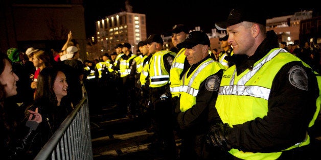 BOSTON, MA - OCTOBER 30: Boston Police line up along a barrier securing the area around Fenway Park after the Boston Red Sox defeated the St. Louis Cardinals 6-1 in Game Six of the 2013 World Series on October 30, 2013 in Boston, Massachusetts. (Photo by Kayana Szymczak/Getty Images)