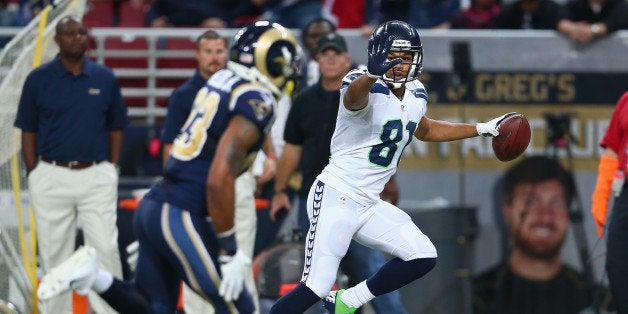 ST LOUIS, MO - OCTOBER 28: Golden Tate #81 of the Seattle Seahawks celebrates as he runs for a touchdown during the 14-9 vic