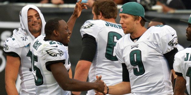 OAKLAND, CA - NOVEMBER 03: LeSean McCoy #25 and Nick Foles #9 of the Philadelphia Eagles celebrate on the sideline against the Oakland Raiders at O.co Coliseum on November 3, 2013 in Oakland, California. The Eagles won 49-20. (Photo by Drew Hallowell/Philadelphia Eagles/Getty Images)