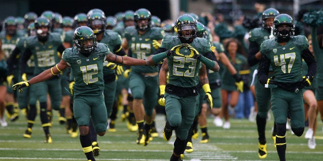 EUGENE, OR - OCTOBER 26: The Oregon Ducks run onto the field before the game against of the UCLA Bruins on October 26, 2013 at the Autzen Stadium in Eugene, Oregon. (Photo by Jonathan Ferrey/Getty Images)