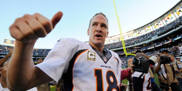 SAN DIEGO, CA - NOVEMBER 10: Peyton Manning #18 of the Denver Broncos celebrates after defeating the San Diego Chargers during the football game at Qualcomm Stadium November 10, 2013 in San Diego, California. (Photo by Kevork Djansezian/Getty Images)