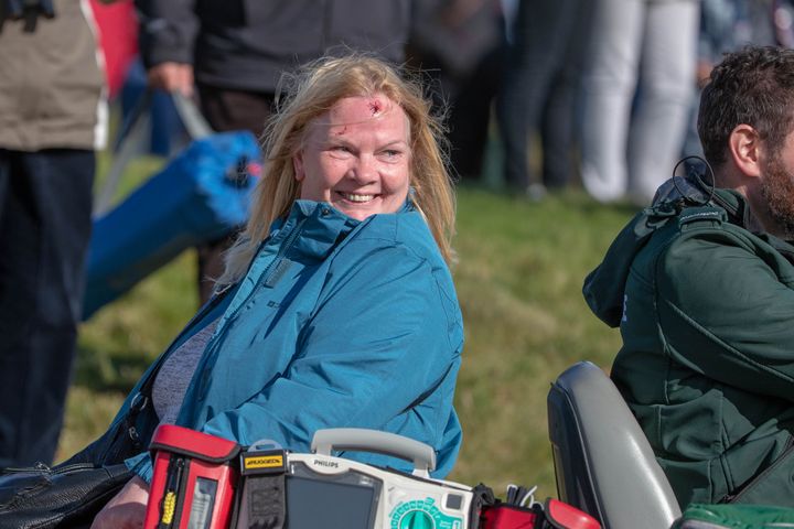 The woman was still smiling as she was taken to the medical centre