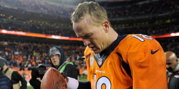 DENVER, CO - NOVEMBER 17 Denver Broncos quarterback Peyton Manning (18) walks off the field after beating the Kansas City Chiefs 27-17. The Denver Broncos vs. the Kansas City Chiefs at Sports Authority Field at Mile High in Denver on November 17, 2013. (Photo by Joe Amon/The Denver Post via Getty Images)