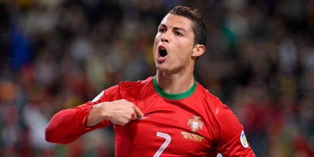Portugal's forward Cristiano Ronaldo celebrates after scoring the second goal for Portugal during the FIFA 2014 World Cup playoff football match Sweden vs Portugal at the Friends Arena in Solna near Stockholm on November 19, 2013 . AFP PHOTO/ JONATHAN NACKSTRAND (Photo credit should read JONATHAN NACKSTRAND/AFP/Getty Images)