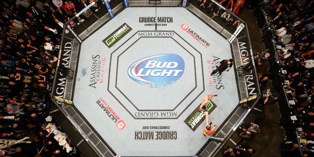 LAS VEGAS, NV - NOVEMBER 16: An overhead view of the Octagon as Georges St-Pierre (black shorts) battles Johny Hendricks (yellow shorts) in their UFC welterweight championship bout during the UFC 167 event inside the MGM Grand Garden Arena on November 16, 2013 in Las Vegas, Nevada. (Photo by Josh Hedges/Zuffa LLC/Zuffa LLC via Getty Images)