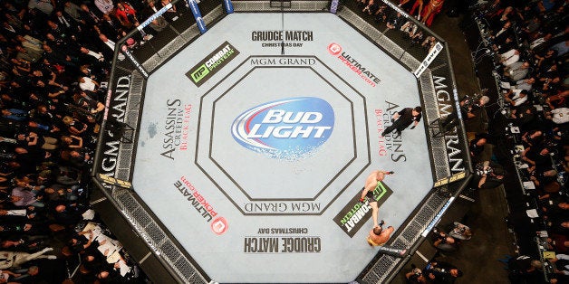 LAS VEGAS, NV - NOVEMBER 16: An overhead view of the Octagon as Georges St-Pierre (black shorts) battles Johny Hendricks (yellow shorts) in their UFC welterweight championship bout during the UFC 167 event inside the MGM Grand Garden Arena on November 16, 2013 in Las Vegas, Nevada. (Photo by Josh Hedges/Zuffa LLC/Zuffa LLC via Getty Images) 