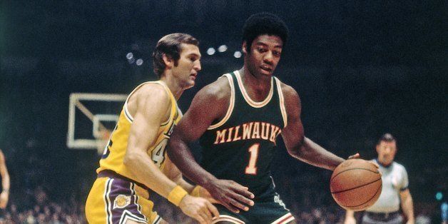 INGLEWOOD, CA - 1971: Oscar Robertson #1 of the Milwaukee Bucks moves the ball up court against Jerry West #44 of the Los Angeles Lakers during a game played circa 1971 at the Great Western Forum in Inglewood, California. NOTE TO USER: User expressly acknowledges and agrees that, by downloading and or using this photograph, User is consenting to the terms and conditions of the Getty Images License Agreement. Mandatory Copyright Notice: Copyright 1971 NBAE (Photo by Wen Roberts/NBAE via Getty Images)
