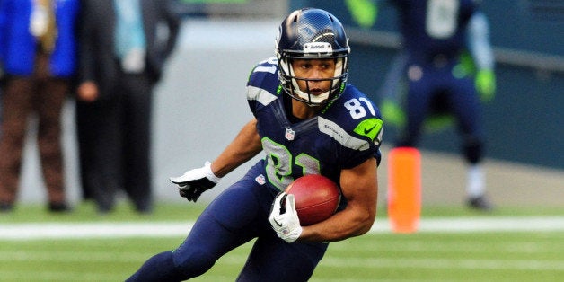 SEATTLE, WA. - NOVEMBER 03: Wide receiver Golden Tate #81 of the Seattle Seahawks returns a punt during the third quarter of the game against the Tampa Bay Buccaneers at CenturyLink Field on November 3, 2013 in Seattle, Washington. Seattle won the game 27-24. (Photo by Steve Dykes/Getty Images)