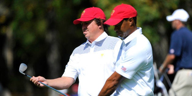 DUBLIN, OH - OCTOBER 01: Jason Dufner and Tiger Woods of the U.S. Team walks the fairway during a practice round prior to the start of The Presidents Cup at the Muirfield Village Golf Club on October 1, 2013 in Dublin, Ohio. (Photo by Chris Condon/PGA TOUR) 