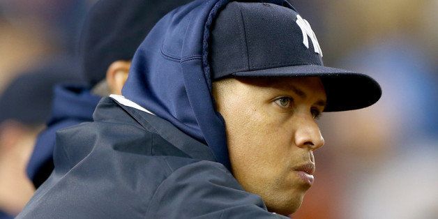 NEW YORK, NY - SEPTEMBER 26: Alex Rodriguez #13 of the New York Yankees looks on from the dugout in the eighth inning against the Tampa Bay Rays on September 26, 2013 at Yankee Stadium in the Bronx borough of New York City. (Photo by Elsa/Getty Images)