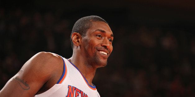 NEW YORK, NY - NOVEMBER 14: Metta World Peace #51 of the New York Knicks smiles during the game against the Houston Rockets during a game at Madison Square Garden in New York City on November 14, 2013. NOTE TO USER: User expressly acknowledges and agrees that, by downloading and or using this photograph, User is consenting to the terms and conditions of the Getty Images License Agreement. Mandatory Copyright Notice: Copyright 2013 NBAE (Photo by Nathaniel S. Butler/NBAE via Getty Images)