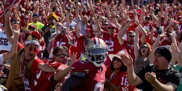 San Francisco 49ers wide receiver Anquan Boldin celebrates with fans after a ten-yard touchdown catch in the second quarter a